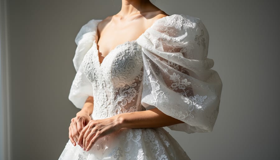 Wedding dress with dramatic statement sleeves featuring sheer organza and lace overlays